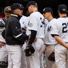 NEW YORK - MAY 17:  Manager Joe Girardi of the New York Yankees talks with A.J. Burnett #34 against the Minnesota Twins on May 17, 2009 at Yankee Stadium in the Bronx borough of New York City. The Yankees defeated the Twins 3-2 in ten innings.  (Photo by 