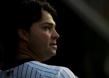 NEW YORK - APRIL 21:  Nick Swisher #33 of the New York Yankees watches from the dugout against the Oakland Athletics on April 21, 2009 at Yankee Stadium in the Bronx borough of New York City.  (Photo by Nick Laham/Getty Images)