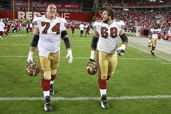 GLENDALE - NOVEMBER 25:  Joe Staley #74 and Adam Snyder #68 of the San Francisco 49ers walk on the field during the NFL game against the Arizona Cardinals at University of Phoenix Stadium on November 25, 2007 in Glendale, Arizona. (Photo by Stephen Dunn/G