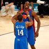 NEW ORLEANS - FEBRUARY 16:  Dwight Howard of the Orlando Magic gets help from teammate Jameer Nelson to put on a Superman costume for Howard's second dunk of the Sprite Slam Dunk Contest, part of 2008 NBA All-Star Weekend at the New Orleans Arena on Febru