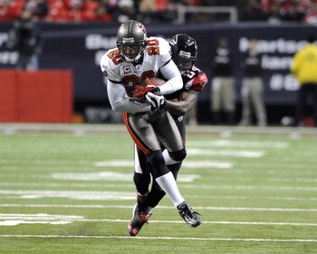 ATLANTA - DECEMBER 14:  Cornerback Ronde Barber #20 of the Tampa Bay Buccaneers intercepts a second-quarter pass against the Atlanta Falcons at the Georgia Dome on December 14, 2008 in Atlanta, Georgia.  (Photo by Al Messerschmidt/Getty Images)