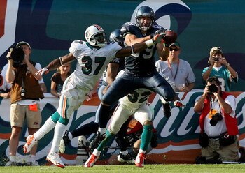 MIAMI - NOVEMBER 09:  Safety Yeremiah Bell #37 of the Miami Dolphins knocks the ball away from tight end John Carlson #89 of the Seattle Seahawks on a failed two-point conversion at Dolphin Stadium on November 9, 2008 in Miami, Florida. The Dolphins defea
