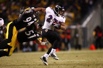 PITTSBURGH - JANUARY 18:  Ray Rice #27 of the Baltimore Ravens runs with the ball against Lawrence Timmons #94 and James Farrior #51 of the Pittsburgh Steelers during the AFC Championship game on January 18, 2009 at Heinz Field in Pittsburgh, Pennsylvania