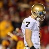 LOS ANGELES, CA - NOVEMBER 29:  Quarterback Jimmy Clausen #7 of the Notre Dame Fighting looks down during the first half against the USC Trojans at the Memorial Coliseum on November 29, 2008 in Los Angeles, California. USC defeated Notre Dame 38-3.  (Phot