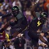 SAN DIEGO, CA - DECEMBER 30:   Runningback LeGarrette Blount #9 of the University of Oregon Ducks celebrates his touchdown with teammate Jaison Williams #4 during his team's 42-31 win over the Oklahoma State University Cowboys in the Pacific Life Holiday 