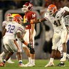 MIAMI - JANUARY 08:  Dustin Doe #32 and Ryan Stamper #41 of the Florida Gators celebrate a defensive stop on a 3rd down play as Sam Bradford #14 of the Oklahoma Sooners looks on dejected during the FedEx BCS National Championship game at Dolphin Stadium o