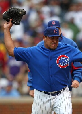 CHICAGO - MAY 27: Starting pitcher Carlos Zambrano #38 of the Chicago Cubs throws his glove into the dugout after being thrown out of a game in the 7th inning against the Pittsburgh Pirates on May 27, 2009 at Wrigley Field in Chicago, Illinois. The Cubs d