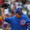 CHICAGO - MAY 27: Starting pitcher Carlos Zambrano #38 of the Chicago Cubs throws his glove into the dugout after being thrown out of a game in the 7th inning against the Pittsburgh Pirates on May 27, 2009 at Wrigley Field in Chicago, Illinois. The Cubs d