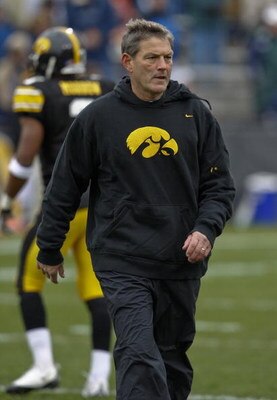 IOWA CITY, IOWA - NOVEMBER 8: Head Coach Kirk Ferentz of the Iowa Hawkeyes runs his team through warm up drills before taking on the  Penn State Nittany Lions at Kinnick Stadium on November 8, 2008 in Iowa City, Iowa. Iowa defeated Penn State  24-23. (Pho