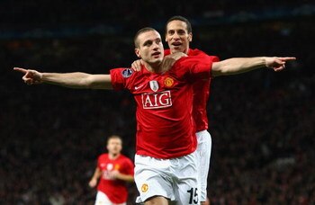 MANCHESTER, UNITED KINGDOM - MARCH 11:  Nemanja Vidic of Manchester United celebrates scoring the opening goal with team mate Rio Ferdinand (R) during the UEFA Champions League Round of Sixteen, Second Leg match between Manchester United and Inter Milan a