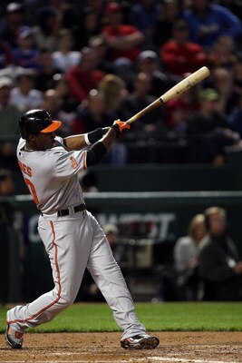 ARLINGTON, TX - APRIL 13:  Adam Jones #10 of the Baltimore Orioles hits a RBI double against the Texas Rangers in the fourth inning on April 13, 2009 at Rangers Ballpark in Arlington, Texas.  (Photo by Ronald Martinez/Getty Images)