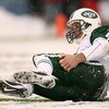 SEATTLE - DECEMBER 21:  Quarterback Brett Favre #4 of the New York Jets gets back up after being tackled by Brandon Mebane of the Seattle Seahawks on the final possession on December 21, 2008 at Qwest Field in Seattle, Washington. The Seahawks defeated th