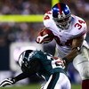 PHILADELPHIA - NOVEMBER 09: Derrick Ward #34 of the New York Giants evades the tackle Quintin Mikell #27 of the Philadelphia Eagles at Lincoln Financial Field on November 9, 2008 in Philadelphia, Pennsylvania.  (Photo by Chris McGrath/Getty Images)