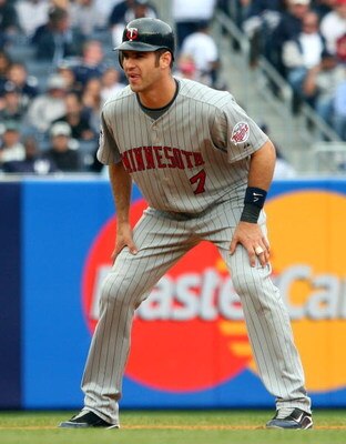 NEW YORK - MAY 17:  Joe Mauer #7 of the Minnesota Twins leads off second base against the New York Yankees on May 17, 2009 at Yankee Stadium in the Bronx borough of New York City. The Yankees defeated the Twins 3-2 in ten innings.  (Photo by Jim McIsaac/G