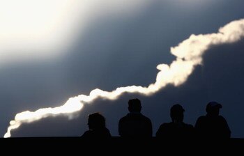 PARIS - MAY 25:  Fans look on as the sun sets over the Suzanne Lenglen court at the French Open on May 25, 2009 in Paris, France.  (Photo by Ryan Pierse/Getty Images)