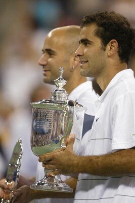 FLUSHING, NY - SEPTEMBER 8:  (FILE PHOTO)  Pete Sampras poses with his trophy and Andre Agassi during the US Open September 8, 2002 at the USTA National Tennis Center in Flushing Meadows Corona Park in Flushing, New York.  Sampras is retiring in a brief c