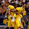 NEW ORLEANS - DECEMBER 21:  Damion Fletcher #25 and Gerald Baptiste #86 of the Southern Mississippi Golden Eagles celebrate after Baptiste scored on a 64 yard pass against the Troy Trojans on during the R+L Carriers New Orleans Bowl on December 21, 2008 a