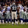 HARLOTTE, NC - OCTOBER 29:  Defensive end Mike Rucker #93 of the Carolina Panthers waits at the line of scrimmage as the Dallas Cowboys huddle during the game on October 29, 2006 at Bank of America Stadium in Charlotte, North Carolina. The Cowboys won 35-