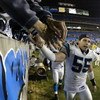 CHARLOTTE, NC - JANUARY 3:  Linebacker Dan Morgan #55 of the Carolina Panthers celebrates after winning the NFC Wildcard game against the Dallas Cowboys at Ericsson Stadium on January 3, 2004 in Charlotte, North Carolina.  The Panthers defeated the Cowboy