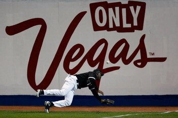 LAS VEGAS - MARCH 04:  Jermaine Dye #23 of the Chicago White Sox can't get to a ball hit for a double by Aramis Ramirez #16 of the Chicago Cubs during an exhibition game at Cashman Field March 4, 2009 in Las Vegas, Nevada.  (Photo by Ethan Miller/Getty Im