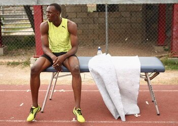 KINGSTON, JAMAICA - APRIL 06:  Usain Bolt of Jamaica sits on a massage table following a training session at the National Stadium on April 6, 2009 in Kingston, Jamaica.  (Photo by Ian Walton/Getty Images)