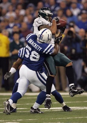 INDIANAPOLIS - NOVEMBER 26:  L.J. Smith #82 of the Philadelphia Eagles makes a reception as he is hit by Gary Brackett #58 of the Indianapolis Colts November 26, 2006 at the RCA Dome in Indianapolis, Indiana.  (Photo by Jonathan Daniel/Getty Images)