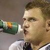 CHARLOTTE, NC - AUGUST 28:  Tackle Jordan Gross #69 of the Carolina Panthers drinks during the preseason game against the New England Patriots at Bank of America Stadium on August 28, 2004 in Charlotte, North Carolina. The Panthers won 20-17. (Photo By Cr