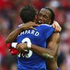 LONDON - APRIL 18: Didier Drogba and Frank Lampard of Chelsea celebrate victory after the FA Cup sponsored by E.ON Semi Final match between Arsenal and Chelsea at Wembley Stadium on April 18, 2009 in London, England.  (Photo by Jamie McDonald/Getty Images