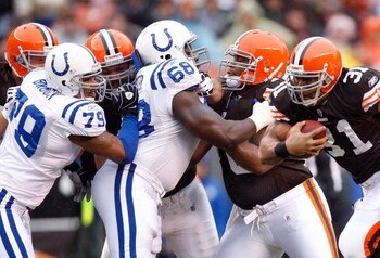 CLEVELAND - NOVEMBER 30:  Jamal Lewis #31 of the Cleveland Browns runs witht he ball against Raheem Brock #79 and Eric Foster #68 of the Indianapolis Colts during their NFL game on November 30, 2008 at Cleveland Browns Stadium in Cleveland, Ohio. The Colt