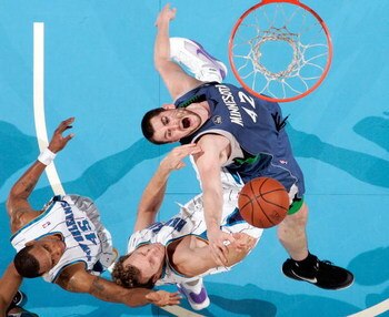 NEW ORLEANS - FEBRUARY 08: Kevin Love #42 of the Minnesota Timberwolves fights for a rebound with Sean Marks #4 of the New Orleans Hornets on February 8, 2009 in New Orleans, Louisiana.  The Hornets defeated the Timberwolves 101-97.  NOTE TO USER: User ex