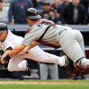 NEW YORK - MAY 17:  Joe Mauer #7 of the Minnesota Twins dives to tag out Brett Gardner #11 of the New York Yankees in the ninth inning on May 17, 2009 at Yankee Stadium in the Bronx borough of New York City. The Yankees defeated the Twins 3-2 in ten innin