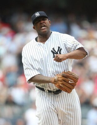 NEW YORK - MAY 24:  CC Sabathia #52 of the New York Yankees pitches against the Philadelphia Phillies on May 24, 2009 at Yankee Stadium in the Bronx borough of New York City.  (Photo by Nick Laham/Getty Images)