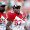 HONOLULU, HI - FEBRUARY 5:  Miami Dolphins tight end Keith Jackson #86 and Pittsburgh Steelers Duval Love #67 of the AFC team watch the action from the sidelines during the 1995 NFL Pro Bowl at Aloha Stadium on February 5, 1995 in Honolulu, Hawaii.  The A