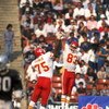 LOS ANGELES - 1986:  Wide receiver Stephone Paige #83 and Irv Eatman #75 of the Kansas City Chiefs celebrate with a high five during a 1986 NFL game against the Los Angeles Raiders at the LA Memorial Coliseum in Los Angeles, California.  The Raiders defea