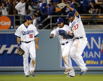 LOS ANGELES, CA - APRIL 30:  Matt Kemp #27 of the Los Angeles Dodgers celebrates a 8-5 win with Manny Ramirez #99 and Andre Ethier #16 over the San Diego Padres after the ninth inning at Dodger Stadium on April 30, 2009 in Los Angeles, California.  The Do