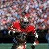 SAN FRANCISCO - SEPTEMBER 16:  Running back Wendell Tyler #26 of the San Francisco 49ers runs with the ball during a game against the New Orleans Saints at Candlestick Park on September 16, 1984 in San Francisco, California.  The 49ers won 30-20.  (Photo 