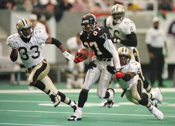 10 DEC 1995:  NEW ORLEANS SAINTS DEFENDERS TYRONE HUGHES #33, ERNEST DIXON #56 AND JIMMY SPENCER #37 ATTEMPT TO STOP ATLANTA FALCONS WIDE RECEIVER BERT EMANUEL #87 IN THE SECOND QUARTER AT THE GEORGIA DOME IN ATLANTA, GEORGIA.  Mandatory Credit: Matthew S