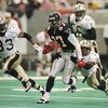10 DEC 1995:  NEW ORLEANS SAINTS DEFENDERS TYRONE HUGHES #33, ERNEST DIXON #56 AND JIMMY SPENCER #37 ATTEMPT TO STOP ATLANTA FALCONS WIDE RECEIVER BERT EMANUEL #87 IN THE SECOND QUARTER AT THE GEORGIA DOME IN ATLANTA, GEORGIA.  Mandatory Credit: Matthew S