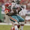 KANSAS CITY, MO - SEPTEMBER 29:  Linebacker Marvcus Patton #53 of the Kansas City Chiefs tackles running back Ricky Williams #34 of the Miami Dolphins during the NFL game on September 29, 2002 at Arrowhead Stadium in Kansas City, Missouri.  The Chiefs won