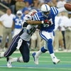 INDIANAPOLIS - NOVEMBER 30:  Marcus Pollard #81 of the Indianapolis Colts cannot control a pass intended for him while defended by Roman Phifer #95 of the New England Partiots on November 30, 2003 at the RCA Dome in Indianapolis, Indiana.  (Photo by Andy 
