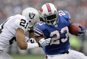 ORCHARD PARK, NY - SEPTEMBER 21: Marshawn Lynch #23 of the Buffalo Bills runs against Nnamdi Asomugha #21 of the Oakland Raiders on September 21, 2008 at Ralph Wilson Stadium in Orchard Park, New York. Buffalo won 24-23.  (Photo by Rick Stewart/Getty Imag