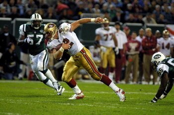 01 Oct 2001: Eric Johnson #82 of the San Francisco 49ers carries against the defense of Mo Lewis #57 of the New York Jets  at Giants Stadium in East Rutherford, New Jersey. The 49ers won 19-17 over the Jets.  Digital Image Mandatory Credit: Al Bello/ALLSP