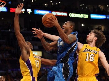 LOS ANGELES, CA - JUNE 04:  Rashard Lewis #9 of the Orlando Magic goes up for a shot against Andrew Bynum #17 and Pau Gasol #16 of the Los Angeles Lakers in the second half of Game One of the 2009 NBA Finals at Staples Center on June 4, 2009 in Los Angele