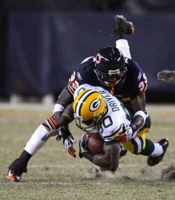 CHICAGO - DECEMBER 22: Charles Tillman #33 of the Chicago Bears brings down Donald Driver #80 of the Green Bay Packers on December 22, 2008 at Soldier Field in Chicago, Illinois. The Bears defeated the Packers 20-17 in overtime. (Photo by Jonathan Daniel/