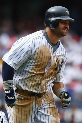 NEW YORK - JUNE 04:  Nick Swisher #33 of the New York Yankees runs to first base against the Texas Rangers during their game on June 4, 2009 at Yankee Stadium in the Bronx borough of New York City.  (Photo by Chris McGrath/Getty Images)