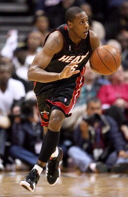 ATLANTA - APRIL 19: Mario Chalmers #6 of the Miami Heat brings the ball up-court against against the Atlanta Hawks during Game One of the First Round of the Eastern Conference Playoffs at Philips Arena on April 19, 2009 in Atlanta, Georgia. The Hawks defe