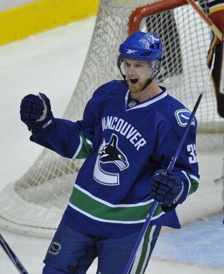 VANCOUVER, CANADA - APRIL 7: Henrik Sedin #33 of the Vancouver Canucks celebrates his goal during their game against Calgary Flames at General Motors Place April 7, 2009 in Vancouver, Canada.   (Photo by Nick Didlick/Getty Images)