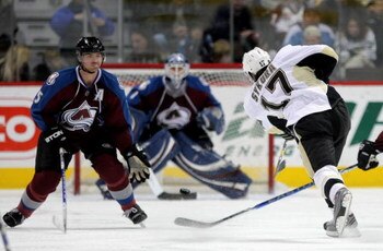 DENVER - JANUARY 10:  Petr Sykora #17 of the Pittsburgh Penguins takes a shot past Brett Clark #5 as goaltender Andrew Raycroft #1 the Colorado Avalanche defends the goal during NHL action at the Pepsi Center on January 10, 2009 in Denver, Colorado. The A