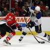 CHICAGO - JANUARY 21: Brad Winchester #15 of the St. Louis Blues fires a shot against James Wisniewski #43 of the Chicago Blackhawks on January 21, 2009 at the United Center in Chicago, Illinois. (Photo byJonathan Daniel/Getty Images)
