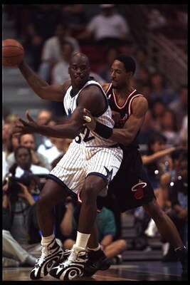 28 Feb 1996: Center Shaquille O'Neal of the Orlando Magic moves against center Alonzo Mourning of the Miami Heat during a game played at the Orlando Arena in Orlando, Florida. The Magic won the game, 116-112.